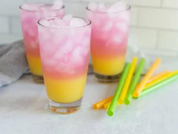 image 15378 - We are sure you're going to think this drink is fin-tastic! Mermaid Water is the best drink you'll find above the sea, featuring a tall glass of icy-cold, sweet berry and glacier freeze sports drinks layered one on top of another, with a bottom layer of tropical pineapple juice. From the bottom to the top of your glass, this drink will have your tastebuds fluttering with glee from under the sea! What's it called again? Mermaid Water! Don't be such a guppy and pour yourself a glass!