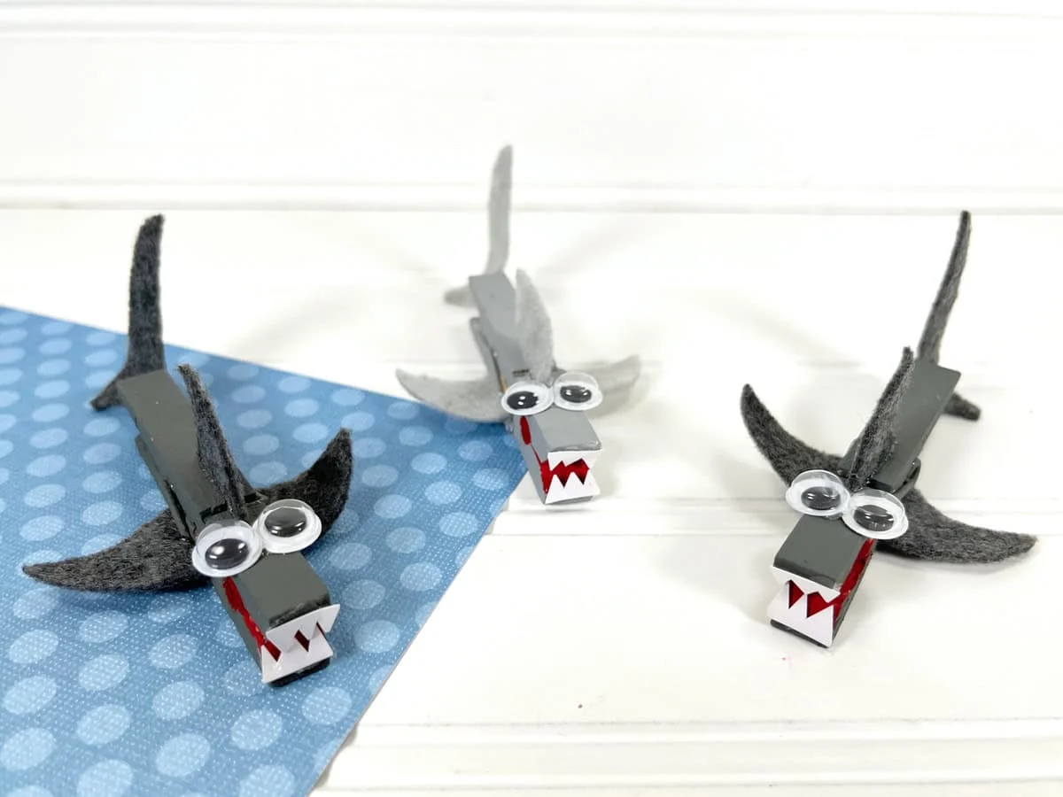 Clothespin Shark feature - Dive into a world of creativity and fun with these shark-themed crafts for kids. Whether you have a budding marine biologist at home or simply want to add a splash of oceanic adventure to your crafting sessions, shark crafts are an exciting way to engage young minds.