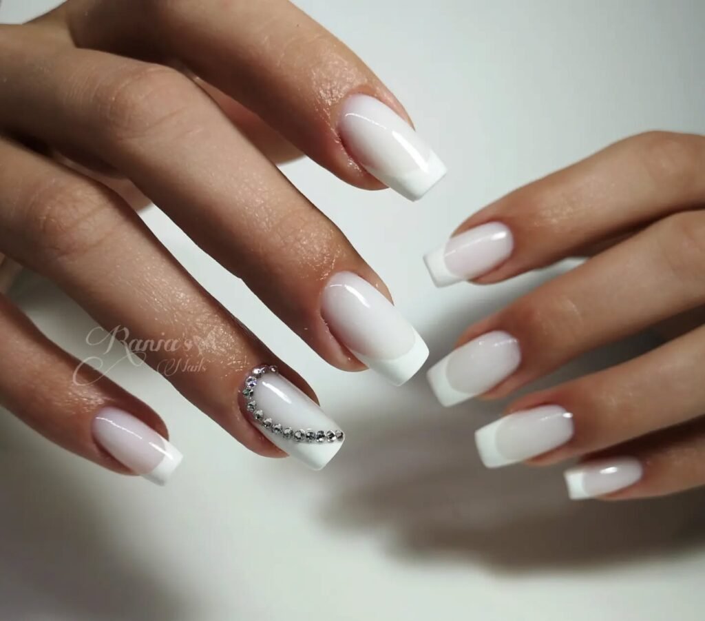 Elegant milky French nails with soft creamy tips, perfect for a timeless and sophisticated look.