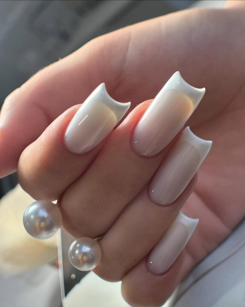 Elegant milky French nails with soft creamy tips, perfect for a timeless and sophisticated look.
