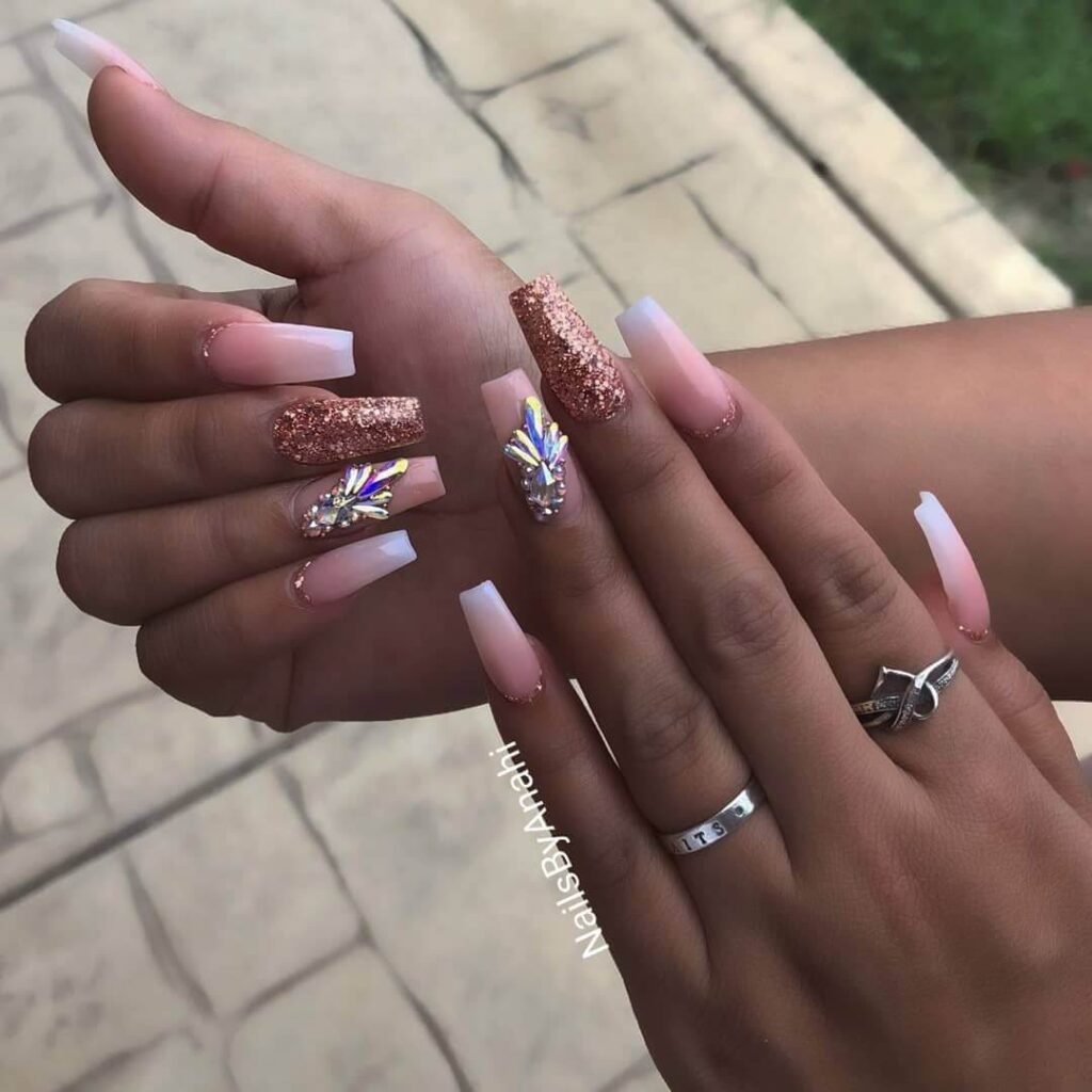 rose gold nails 18 - Rose gold nails are the epitome of elegance and versatility, offering a perfect blend of femininity and sophistication. This stunning nail trend has taken the beauty world by storm, combining soft pink hues with a metallic gold shimmer to create a look that suits every occasion.