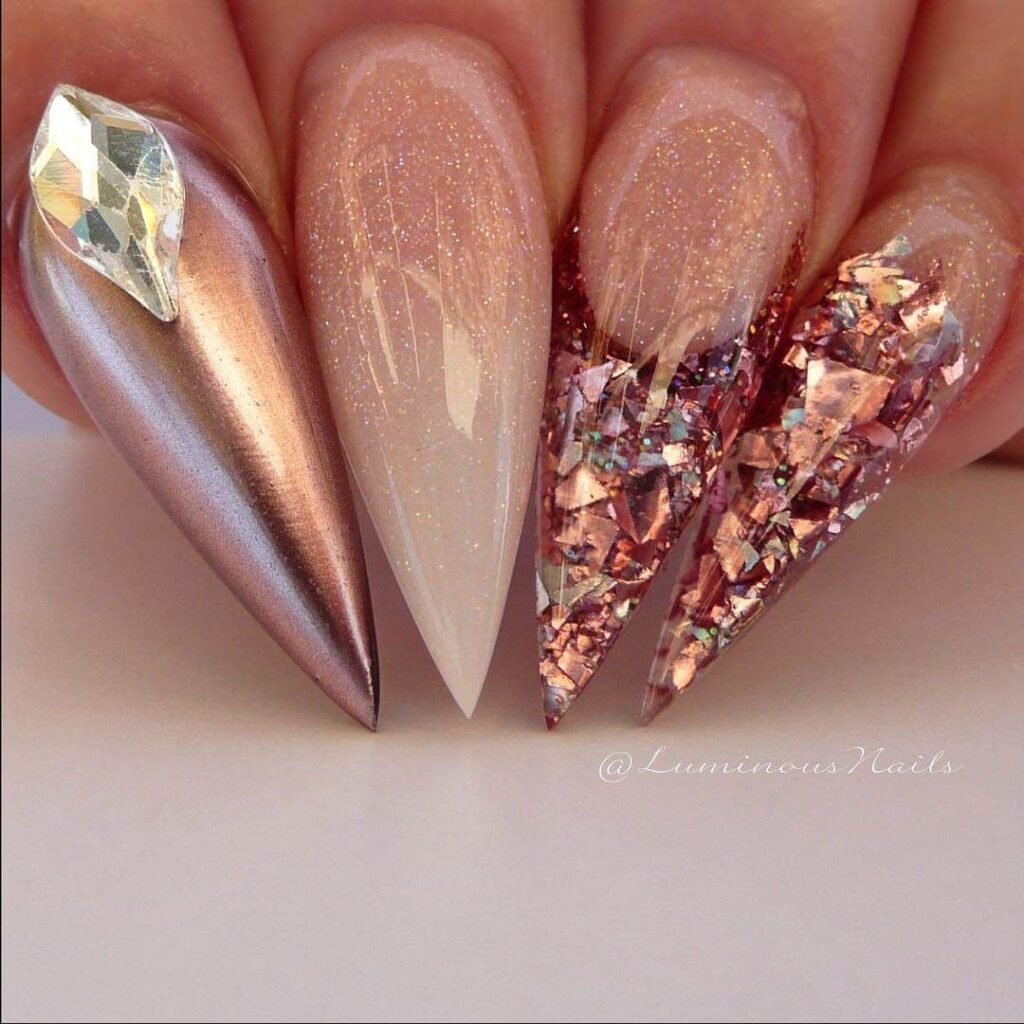 rose gold nails 19 - Rose gold nails are the epitome of elegance and versatility, offering a perfect blend of femininity and sophistication. This stunning nail trend has taken the beauty world by storm, combining soft pink hues with a metallic gold shimmer to create a look that suits every occasion.