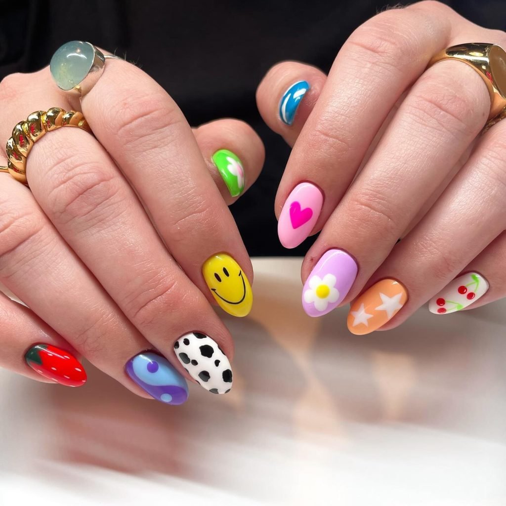 01 Short Maximalist Nails - Short maximalist nail designs prove that bold, extravagant nail art isn't just for long nails. Even with a shorter length, you can rock short maximalist nail designs packed with vibrant colors, intricate patterns, and eye-catching embellishments.