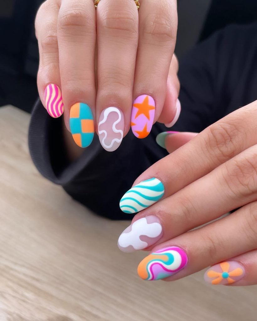 05 Short Maximalist Nails - Short maximalist nail designs prove that bold, extravagant nail art isn't just for long nails. Even with a shorter length, you can rock short maximalist nail designs packed with vibrant colors, intricate patterns, and eye-catching embellishments.