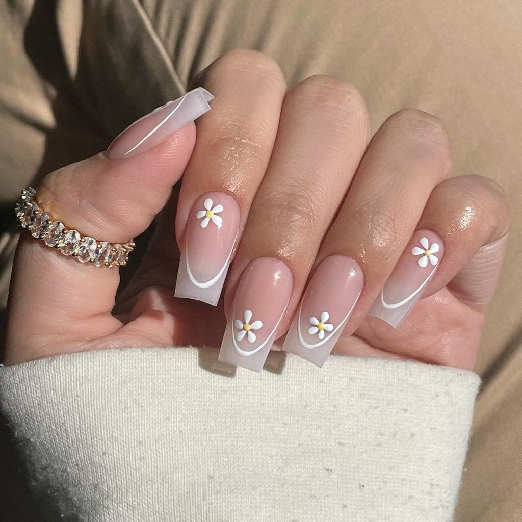 00001 French Nails with Flowers - Ever since I was a teen experimenting with nail art, French Nails With Flower Design has been my go-to style for adding a touch of elegance and charm. There’s something timeless about French Nails With Flower Design, blending the classic white tips with delicate floral patterns that make my hands feel instantly graceful.