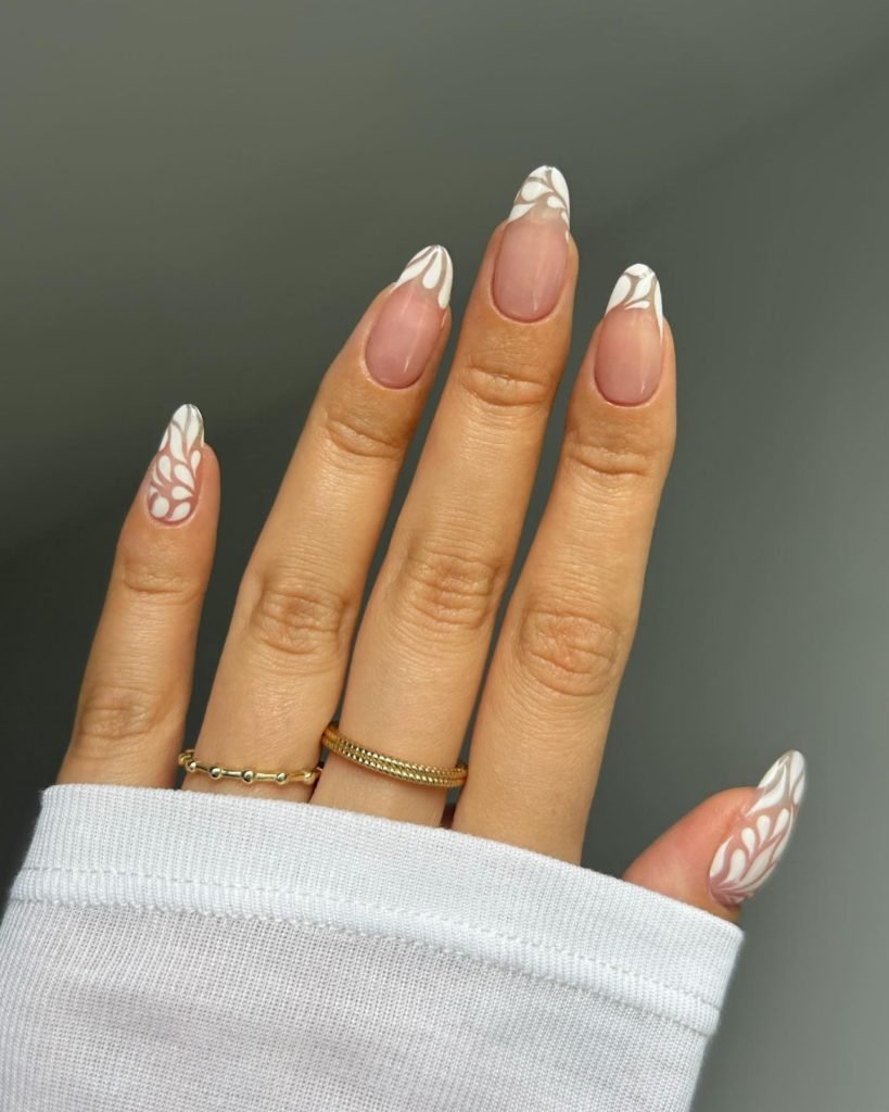 00007 French nails with flowers 2 - Ever since I was a teen experimenting with nail art, French Nails With Flower Design has been my go-to style for adding a touch of elegance and charm. There’s something timeless about French Nails With Flower Design, blending the classic white tips with delicate floral patterns that make my hands feel instantly graceful.