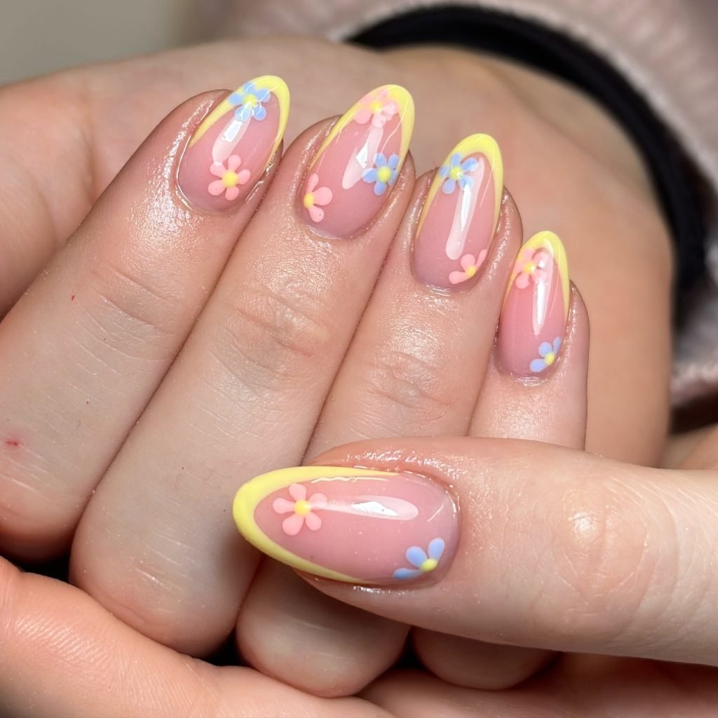 00014 French nails with flowers 2 - Ever since I was a teen experimenting with nail art, French Nails With Flower Design has been my go-to style for adding a touch of elegance and charm. There’s something timeless about French Nails With Flower Design, blending the classic white tips with delicate floral patterns that make my hands feel instantly graceful.