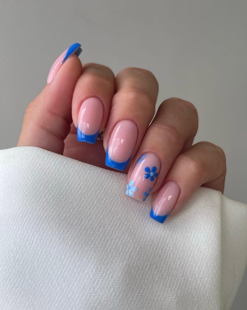 1 00006 French nails with flowers 2 - Ever since I was a teen experimenting with nail art, French Nails With Flower Design has been my go-to style for adding a touch of elegance and charm. There’s something timeless about French Nails With Flower Design, blending the classic white tips with delicate floral patterns that make my hands feel instantly graceful.