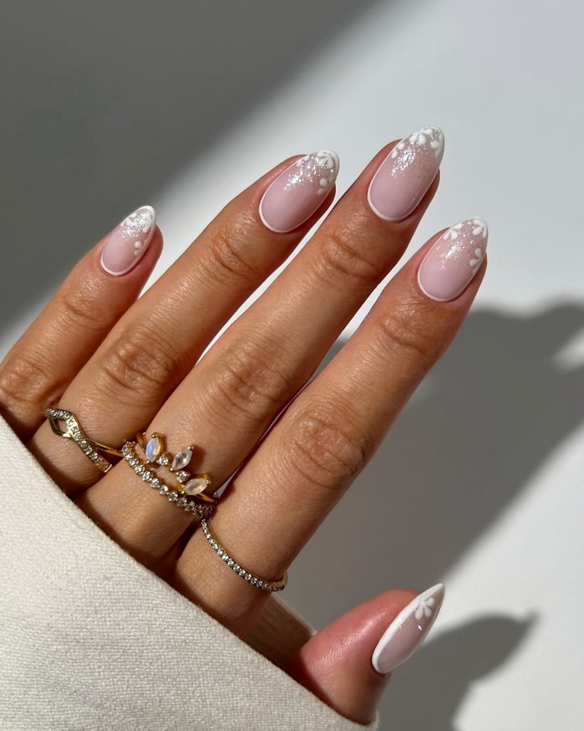 1 00012 French nails with flowers 2 - Ever since I was a teen experimenting with nail art, French Nails With Flower Design has been my go-to style for adding a touch of elegance and charm. There’s something timeless about French Nails With Flower Design, blending the classic white tips with delicate floral patterns that make my hands feel instantly graceful.