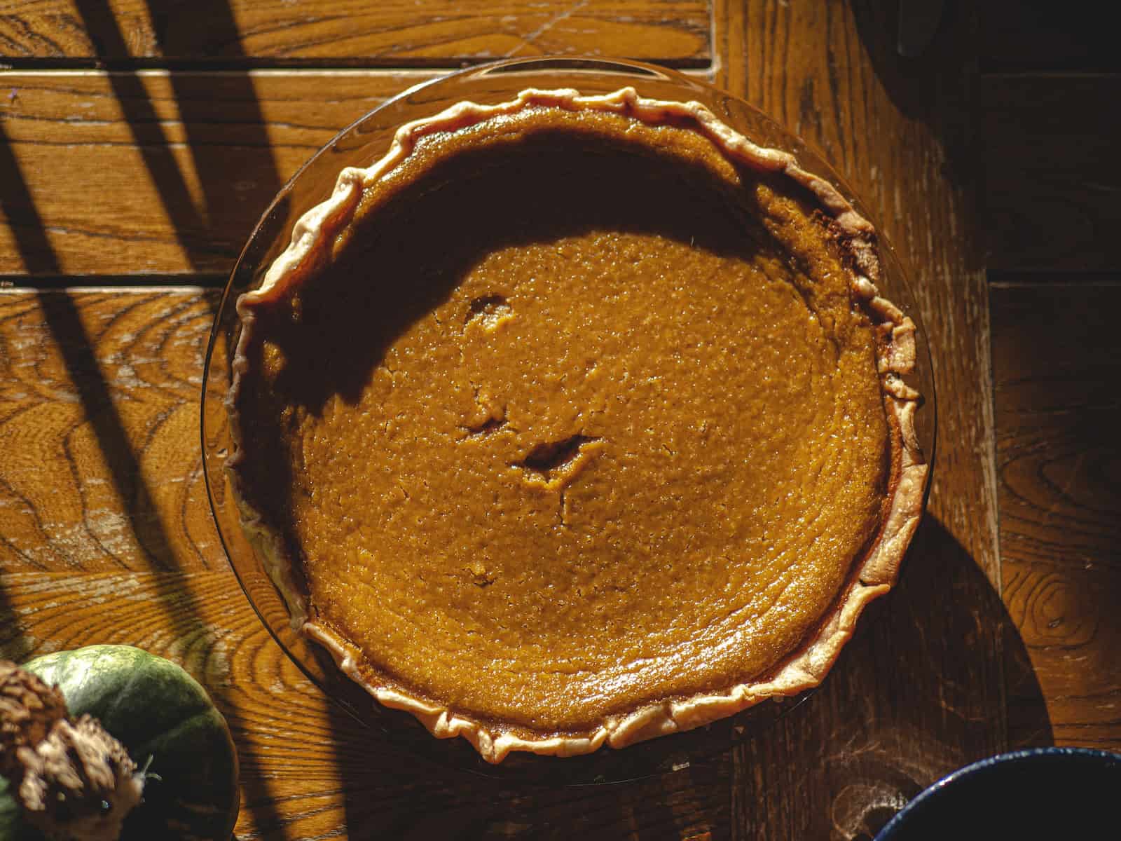 pumpkin pie in brown and white ceramic bowl