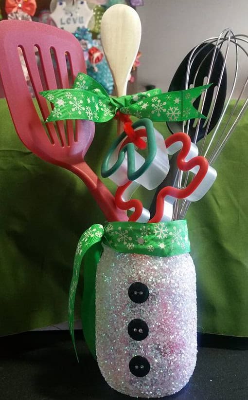 25. DIY Snowman Mason Jar Craft - These Christmas crafts with mason jars are ideal for anyone who enjoys crafting indoors while the winter chill keeps them inside.