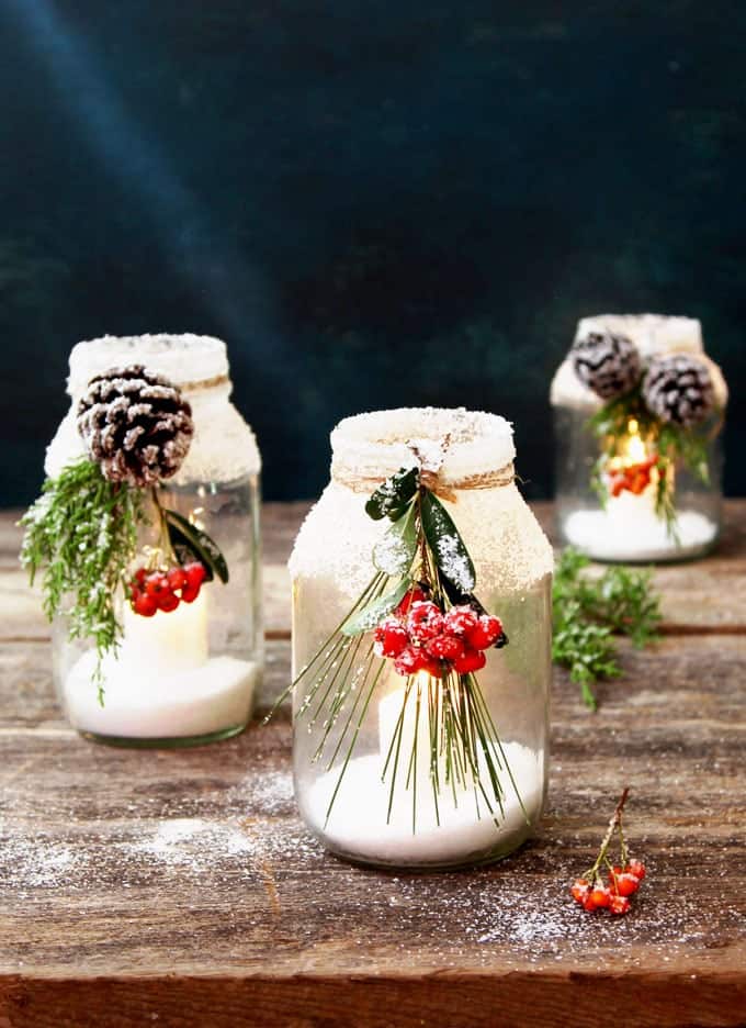 27. Snowy DIY Mason Jar Centerpieces - These Christmas crafts with mason jars are ideal for anyone who enjoys crafting indoors while the winter chill keeps them inside.