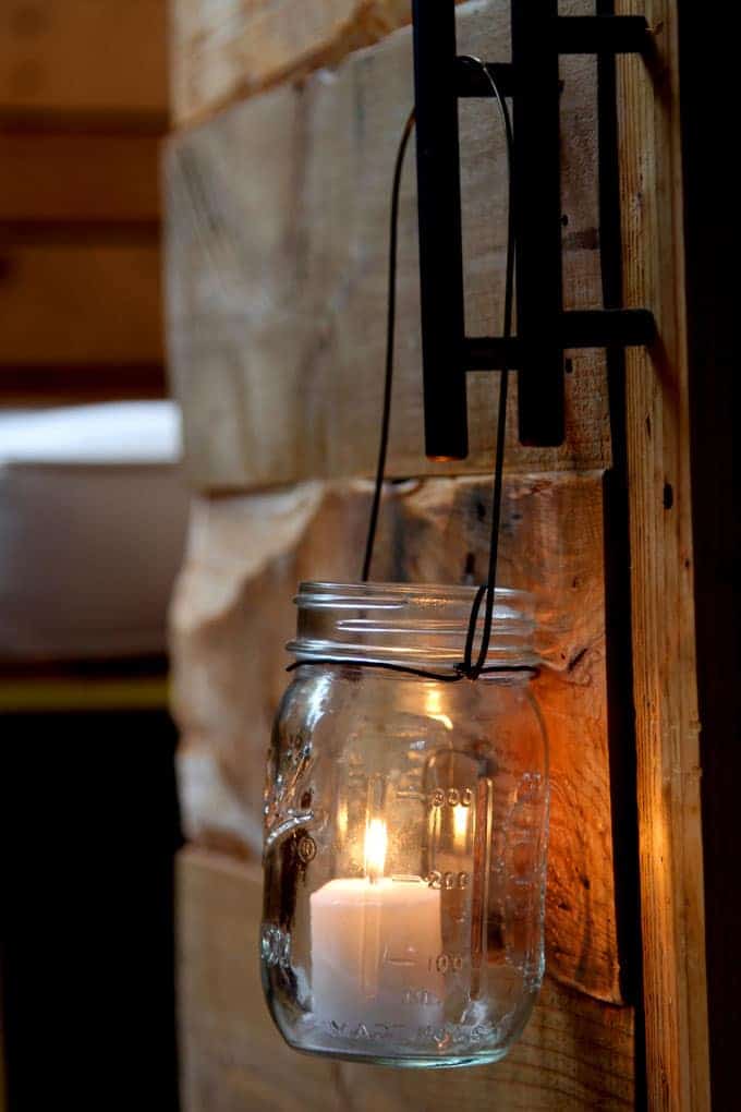 28. Magical DIY Hanging Mason Jar Lights - These Christmas crafts with mason jars are ideal for anyone who enjoys crafting indoors while the winter chill keeps them inside.