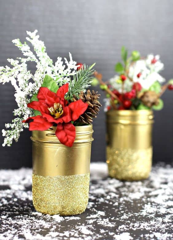 30. Gold Glittered Mason Jar Vases - These Christmas crafts with mason jars are ideal for anyone who enjoys crafting indoors while the winter chill keeps them inside.