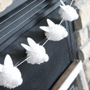 bunny pom pom garland - Enhance your spring adornments using these Dollar Tree Easter decor suggestions! Unearth budget-friendly DIY Easter decorations that will inject a celebratory vibe into your surroundings. From delightful Dollar Tree Easter wreaths to sophisticated spring table arrangements, our spring decor concepts are ideal for rejuvenating your living space.