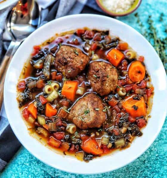 Crockpot meatball soup in white bowl