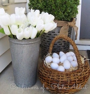 CONFESSIONS OF A PLATE ADDICT Farmhouse Spring Porch 2 thumb3 - Embrace the allure of DIY dollar tree farmhouse Easter decoration concepts! Uncover rustic Easter table arrangements and homemade farmhouse Easter entrance adornments to establish a cozy, inviting ambiance.