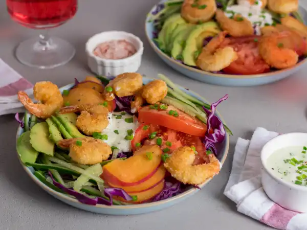 Fried Shrimp Salad 2 - Fried Shrimp Salad is a delightful and sophisticated dish that combines the crunchy, tropical flair of coconut shrimp with the fresh, crisp textures of a thoughtfully assembled salad.