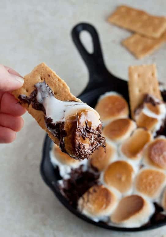 Indoor Smores 037 - Savor the delightful flavors of summer with these delectable smores treats! From luscious chocolate bars to crunchy cookies, our simple smores recipes will fulfill all your sweet cravings. Whether you're out camping amidst nature's beauty or simply seeking delightful camping sweets to share with loved ones, these summertime desserts are a must-have. Don't overlook these ideal summer indulgences!