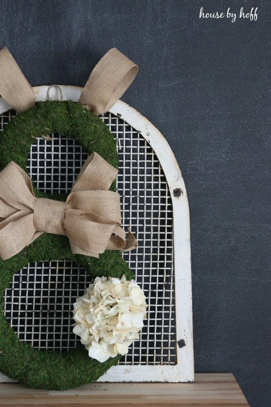 Moss and Burlap Easter Bunny Wreath via House by Hoff 61 - Discover the allure of crafting your own Easter wreaths for the front door with these imaginative Easter wreath decoration concepts! Embrace a variety of styles, including rustic Easter wreaths, Easter egg wreaths, Easter bunny wreaths, and Easter basket wreaths, as well as vibrant spring flower wreaths.