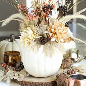 White Pumpkin Vase - Rustic fall decor embodies the cozy charm and natural beauty of the autumn season. Drawing inspiration from the rich hues of changing leaves, the crispness in the air, and the warmth of harvest gatherings, rustic fall decor incorporates elements such as weathered wood, burlap, dried foliage, and muted earth tones.