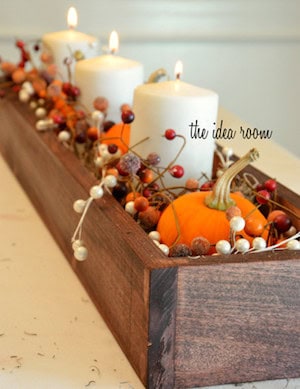 thanksgiving center piece 10 thumb - Rustic fall decor embodies the cozy charm and natural beauty of the autumn season. Drawing inspiration from the rich hues of changing leaves, the crispness in the air, and the warmth of harvest gatherings, rustic fall decor incorporates elements such as weathered wood, burlap, dried foliage, and muted earth tones.