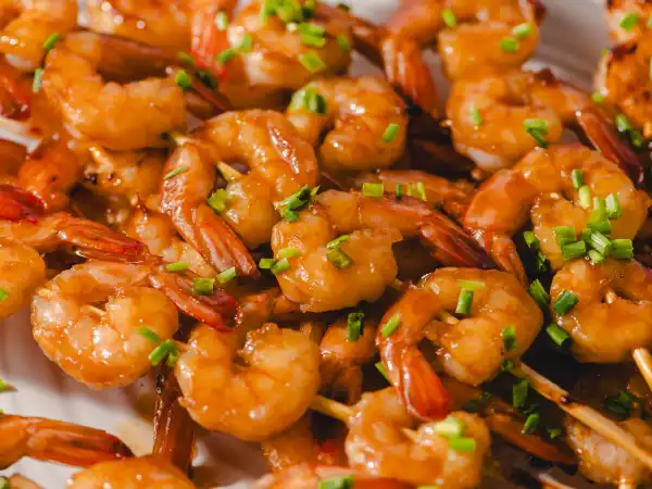 1 275 - Easy. Delicious. Need we say more?! Honey Shrimp Skewers are a quick and amazing way to treat your guests as they await the main meal. Simply marinate some plump shrimp in a tasty, Asian-inspired marinade, throw the skewers on the grill, and you have outstanding nibbler right off the stick that everyone will go crazy for. Better double or even triple the recipe, because with the temptation of Honey Shrimp Skewers, they are sure to quickly disappear right before your eyes. Who needs dinner?!