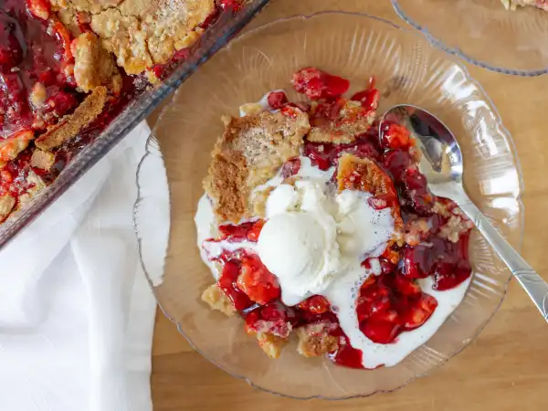 1 296 - When a dessert explodes with flavor, you just know it's a treat you'll want on repeat! Versatile and easy to love, Cherry Eruption Cake will become a fast favorite, especially for those who, ahem, don't absolutely love baking. So, wave goodbye to complex sweets, because this one is so easy to pull together. Just grab a couple cans of tangy, sweet cherry pie filling, the always-on-hand yellow cake mix, some melted butter, and a dash of amazing almond extract and immediately the vanilla ice cream everywhere will be screaming for joy to join in the fun! This explosively, easy-peasy concoction we call Cherry Eruption Cake is the great flood of flavor you've been waiting for. In a flash, you will be gushing from all the compliments to the baker!
