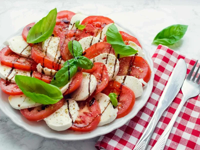 1 53 - This Easy Caprese Salad is truly delicious, fresh, and so quick to make. Simply slice the ingredients, arrange, and voilà! Feel free to have a little fun with your Easy Caprese Salad and arrange the ingredients in your favorite shapes; why not stack the creamy mozzarella and fresh tomatoes in a stack for a towering salad? How about a candy cane shape at Christmas, or a heart for a bridal shower or Valentine's? The flavor combination is a classic in bright garden tastes so it's a perfect side for almost any meal regardless of the season.