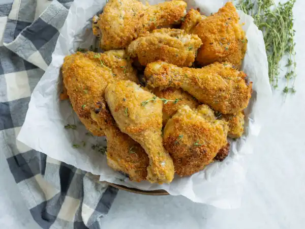 2 98 - Nothing says picnic like some good chicken. And Oven-Fried Parmesan Chicken is the kind of next-level picnic chicken that everyone will go crazy for! Tossed in an egg bath and coated with a flavorful parmesan breadcrumb topping, this chicken gets to tan oven-side for a bit, and then is quickly on its way to a checkered tablecloth near you. Tasty, good Oven-Fried Parmesan Chicken is not only the best you will ever have, but also a quick fix anytime you need a good meal fast... checkered tablecloth (not always) required!