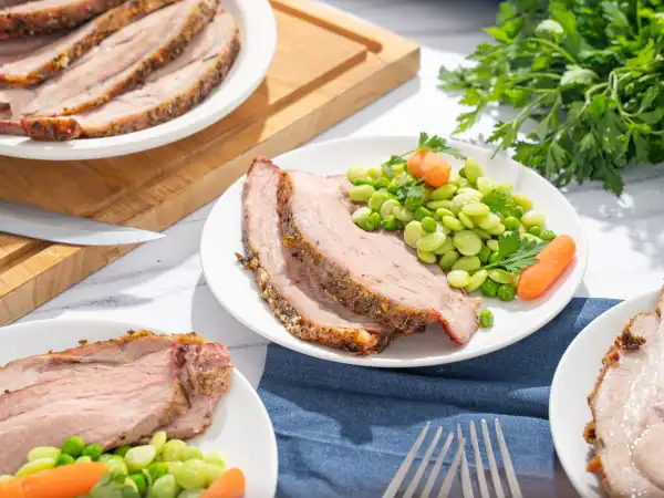 1 139 - Garlic Rubbed Pork is rubbed with garlic, but that sort of undersells it. It's actually rubbed with a homemade herb and roasted garlic oil, and the pork is butterflied for easier, more balanced roasting. It's also served with a collection of tender veggies and a simple balsamic pan sauce that accents the succulence of the pork! Garlic Rubbed Pork is a full dinner experience in one dish!