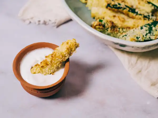 1 28 - When a savory side dish is on your mind, kick the potato to the curb. Savory Zucchini Sticks are the perfect answer for your snack or side dish needs. Sliced like that other vegetable in a French-fry shape, these zesty, coated zucchini sticks are baked until golden-brown. They're perfect for dipping in a creamy, zingy Greek-yogurt-and-chive-creation that will make you forget all about its tomato-based counterpart (or you may like that too, and that's ok). Savory Zucchini Sticks are adult-and-kid-friendly and will become a new staple. They are easy, quick, delicious, and sure to please the masses! Step aside our little, fried spud friend, there's a new zealously baked veggie in town!