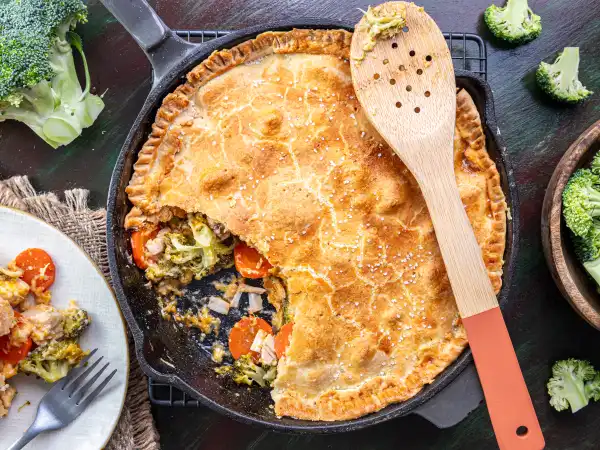 2 54 - Chicken pot will never be the same. How can it be when Broccoli Cheddar Pot Pie exists? The idea of adding cheddar and broccoli soup to a pot pie and making it the filling? Pure genius. The filling is stuffed with the tender broccoli and that creamy and sharp cheddar flavor you love in a bread bowl... well, now it's in a pie bowl! Oh, and there's chicken! Can't forget that! Broccoli Cheddar Pot Pie will be making everyone wonder what else can be improved with a little soup inspiration.