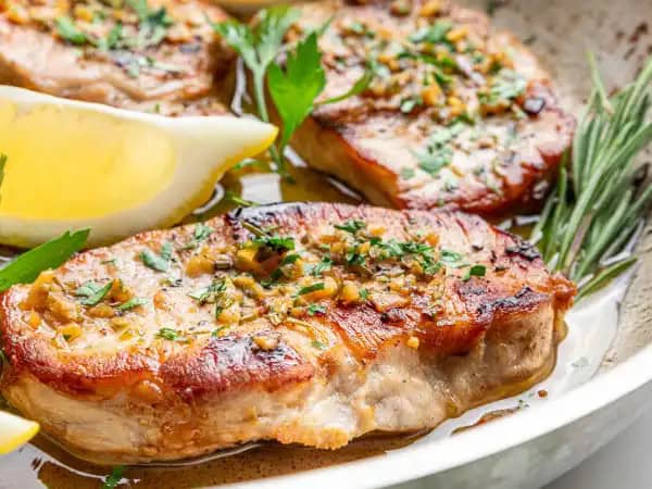 image 10172 - Sometimes simple is just so good! And with Baked Boneless Chops, you would never guess just how easy good food can be to make. Boneless pork chops are browned and then baked in a garlic-rosemary sauce for an extra special touch. Simple, yet elegant, and very delicious, these perfectly seasoned Baked Boneless Chops are the way to go when you want good food fast that tastes nothing like fast food. Take your time and enjoy!