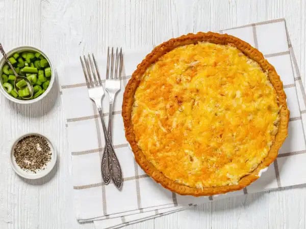 image 10179 - If you are a chick (or dude) that loves chicken salad, we have a switch-up just for you! Chicken Salad Pie takes your favorite bite and adds a little surprise. A crispy pie crust gets topped with all the creamy components of chicken salad that you already trust, along with a cheddar-and-Gruyère-cheese blend melted right on top! Yummy! Who knew there were so many ways chicken salad could be eaten?! Chicken salad chicks (and dudes) know where it's at with this Chicken Salad Pie!
