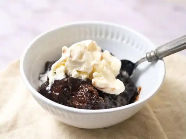 image 10190 - Mercy! If you are a chocoholic (or even if you aren't), we've just found your sweet tooth's new fudgy infatuation! Copycat Chocolate Cobbler is so worth duplicating! The easy-to-make, pudding-like, yet also cake-like features of this over-the-top, ooey, gooey, chocolatey dessert makes all other chocolate treats seem pale in comparison. Add some vanilla ice cream and Copycat Chocolate Cobbler is all you will ever need to satisfy your "got to have chocolate" urge. You've got to make some... copy that!