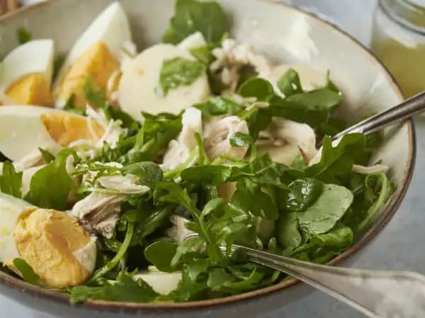 image 10297 - Freshness is abounding in every bite! Heart-of-Palm Salad is a wonderful addition to any meal, and we know you're going to fall in love. Fresh arugula, hard-boiled eggs, shredded chicken breast, and the unique vegetable heart of palm are piled up and drizzled with a lemon vinaigrette to all come together and give this salad a great name. Heart-of-Palm Salad will become a new love for everyone. It's certainly dear to our hearts!