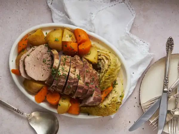 image 10471 - Beloved throughout the world and especially in Ireland and England, Classic Corned Beef & Cabbage is rustic home-cooking at its finest! The corned beef is boldly beefy and wonderfully spiced, as it's cooked to tenderness in a homemade beef broth. Fluffy potatoes, sweet cabbage, and bright carrots are also cooked in the broth, so everything is infused with the rich, meaty flavor. Classic Corned Beef & Cabbage is comforting and nostalgic, and you'll be having fond memories of it for long after you eat it!