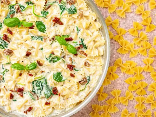 image 10875 - If you're looking to dress up your dinner table, we have the appropriate dinner attire made just for it! Creamy Bow Tie Pasta is squarely one of the best things you will ever eat. Al-dente-fashioned bowtie pasta is draped with a creamy parmesan sauce and flanked with some fresh spinach for the perfect dinner ensemble. Add a new twist to your delicious meal with Creamy Bow Tie Pasta. "Tie" some on tonight! Black jackets and formal gowns are not required!