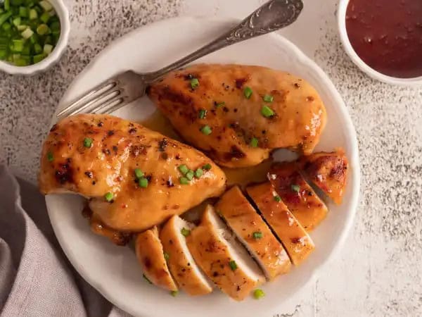 image 10920 - Dress your chicken for success! Sweet N' Spicy Chicken Breasts will become a fast favorite, lighting up your dinner runway of chicken dressing options. Step right this way as your plump, juicy chicken breasts get all glammed-up in a sweet and spicy sauce made of brown sugar, hot sauce, and apple cider vinegar with a touch of garlic, before getting baked to golden-brown perfection. These sauntering Sweet N' Spicy Chicken Breasts will be all the rage at your next star-studded event or quiet meal for two. Whatever the case, let your chicken strut its stuff in all your dinner catwalks. It will stun you and leave everyone smiling. Work it!