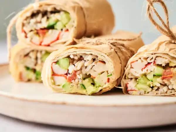 image 11590 - Looking for a lighter lunch or dinner? Well, let's wrap this up for the week! Skinny California Roll-Ups are a wonderful change of pace that will also help curb the urge for weekend sushi. Whole-wheat tortilla wraps are loaded with crabmeat and a tasty brown rice mixture that's topped with juicy tomatoes, chilled cucumbers, and creamy avocados. All that is tightly wrapped to keep the delicious flavors all smushed together. These Skinny California Roll-Ups will perk up any meal and get you rolling towards the weekend. There you have it; the perfect answer to a perfect weekday meal. And that's a wrap!