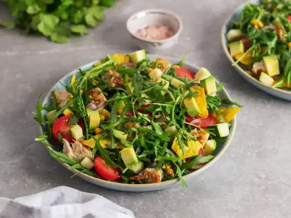 image 11620 - Summer is popping and it is time to get outside and enjoy the weather. Grilled Chicken Taco Salad is the perfect dish to add to your beautiful-weather meal lineup! Grilled and juicy, these chicken breasts are surrounded by crisp, peppery arugula, sweet grilled corn, crunchy tortilla chips, zesty zucchini, ripe avocado, and plump cherry tomatoes. All of that goodness is immersed in a tangy lime-infused vinaigrette that is absolutely breathtaking. Enjoy the weather and your food — try Grilled Chicken Taco Salad and spice things up a bit. Summer never tasted so good!