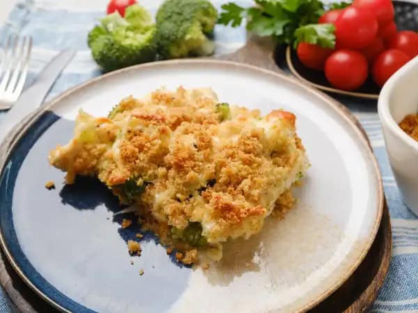image 12700 - This casserole isn't just good... it's so much better than that! It's Too Too Good Casserole! Savory chicken in a creamy, cheesy, tangy chicken sauce with crunchy fresh broccoli, would make anyone smile. But throw on some buttery, crunchy breadcrumbs? Oh yes, we're going way past good cooking and right into the realm of the great! Too Too Good Casserole is just that... too, too good!