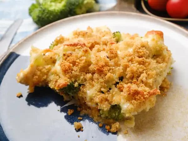 image 12704 - This casserole isn't just good... it's so much better than that! It's Too Too Good Casserole! Savory chicken in a creamy, cheesy, tangy chicken sauce with crunchy fresh broccoli, would make anyone smile. But throw on some buttery, crunchy breadcrumbs? Oh yes, we're going way past good cooking and right into the realm of the great! Too Too Good Casserole is just that... too, too good!