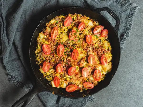 image 12842 - Ya know? Sometimes you just have to eat breakfast for dinner. And if it were up to us, it'd happen a lot more than it does. Especially when Supper Eggs can be served up! We start drooling just thinking about this hearty breakfast (for dinner) skillet that's loaded with spicy sausage, fluffy eggs, crispy bacon, crunchy hash brown potatoes, and melty cheese. You're guaranteed to have sweet dreams after chowing down on some Supper Eggs. And then tomorrow morning you can do it all over again (at whatever time you want)! YUM!