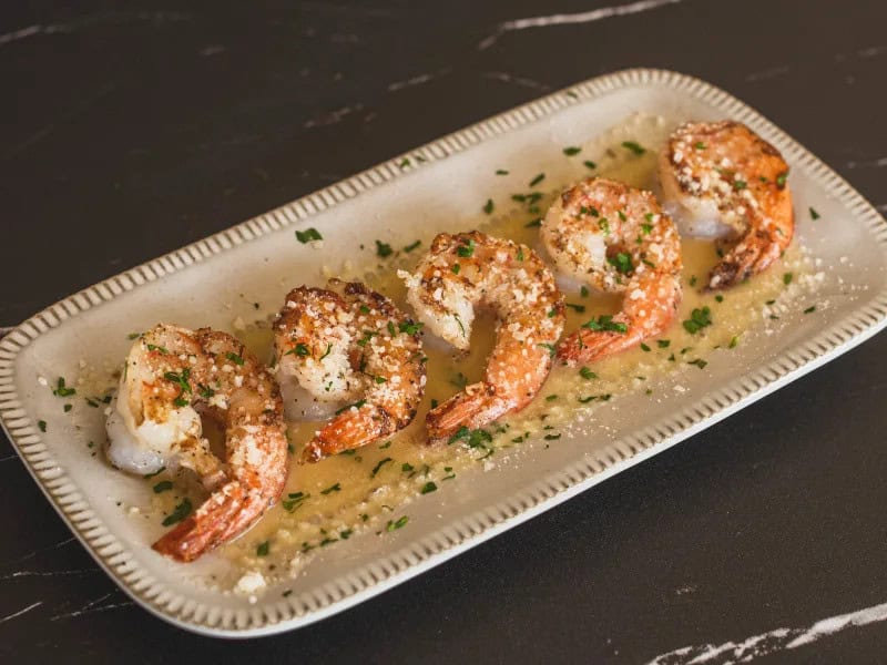 image 1327 - Craving a restaurant-worthy meal in the comfort of your own home? Copycat Scampi is the one for you! This dish brings all the buttery, garlicy, and lemony goodness of plump, tender shrimp straight to your dinner table. And the best part? You don't have to leave your house or break the bank to enjoy it. So why settle for takeout when you can make a copycat dish that's even better than the original? Treat yourself and your loved ones to Copycat Scampi!