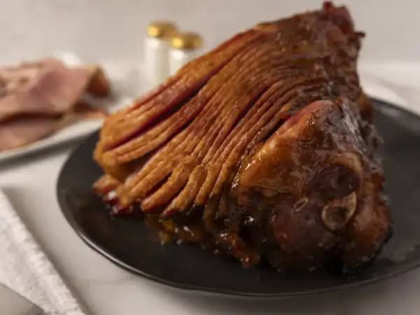 image 13474 - It's the holidays! Or maybe it isn't yet... that's not important! What IS important is that it's time to bust out the main course to end all main courses! One dish fits the bill; Glazed Spiral Ham. Succulent, salty ham coated in a fruity, tangy, tropical spread that adds a wonderful contrasting sweetness to the deeply meaty flavor. Slow-roasted until it almost falls off the bone, Glazed Spiral Ham runs circles around all other meals!