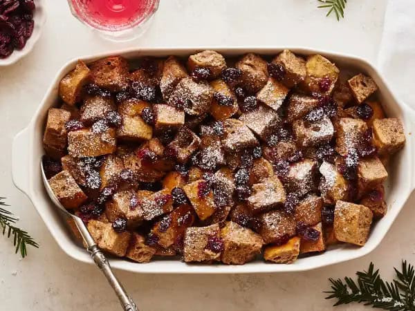 image 13590 - Run, run, run as fast as you can! Get to the table; this dish is hot and ready! Gingerbread Man Breakfast Bake is exactly the kind of morning magic you'll want to catch on your fork. Your favorite bread is soaked in a creamy, warmly spiced custard and sprinkled with tart-yet-sunny-sweet, orange juice-soaked cranberries! Drizzled with maple syrup or dusted with powdered sugar (or both!), Gingerbread Man Breakfast Bake is the stuff of fairy tales!