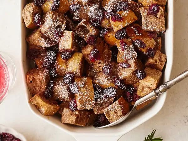 image 13593 - Run, run, run as fast as you can! Get to the table; this dish is hot and ready! Gingerbread Man Breakfast Bake is exactly the kind of morning magic you'll want to catch on your fork. Your favorite bread is soaked in a creamy, warmly spiced custard and sprinkled with tart-yet-sunny-sweet, orange juice-soaked cranberries! Drizzled with maple syrup or dusted with powdered sugar (or both!), Gingerbread Man Breakfast Bake is the stuff of fairy tales!
