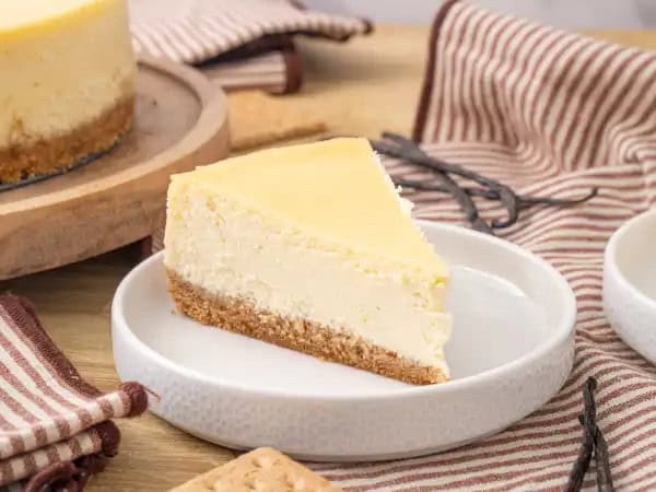 image 13715 - The classics are necessary to help us remember just how good things can be. Classic New York Cheesecake is the president of the classic club, and if you haven't tried a slice of this already, we know it will be a fast favorite. Creamy, dreamy, and easy – all these "y"-ending words will entice you to make this famous, first-rate dessert. You don't have to take a trip to the Empire State to try a slice of this Classic New York Cheesecake! Get one in your oven today!
